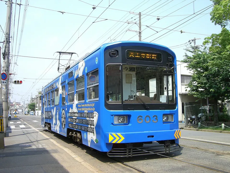 Hankai Tramway tram running at street level in Osaka