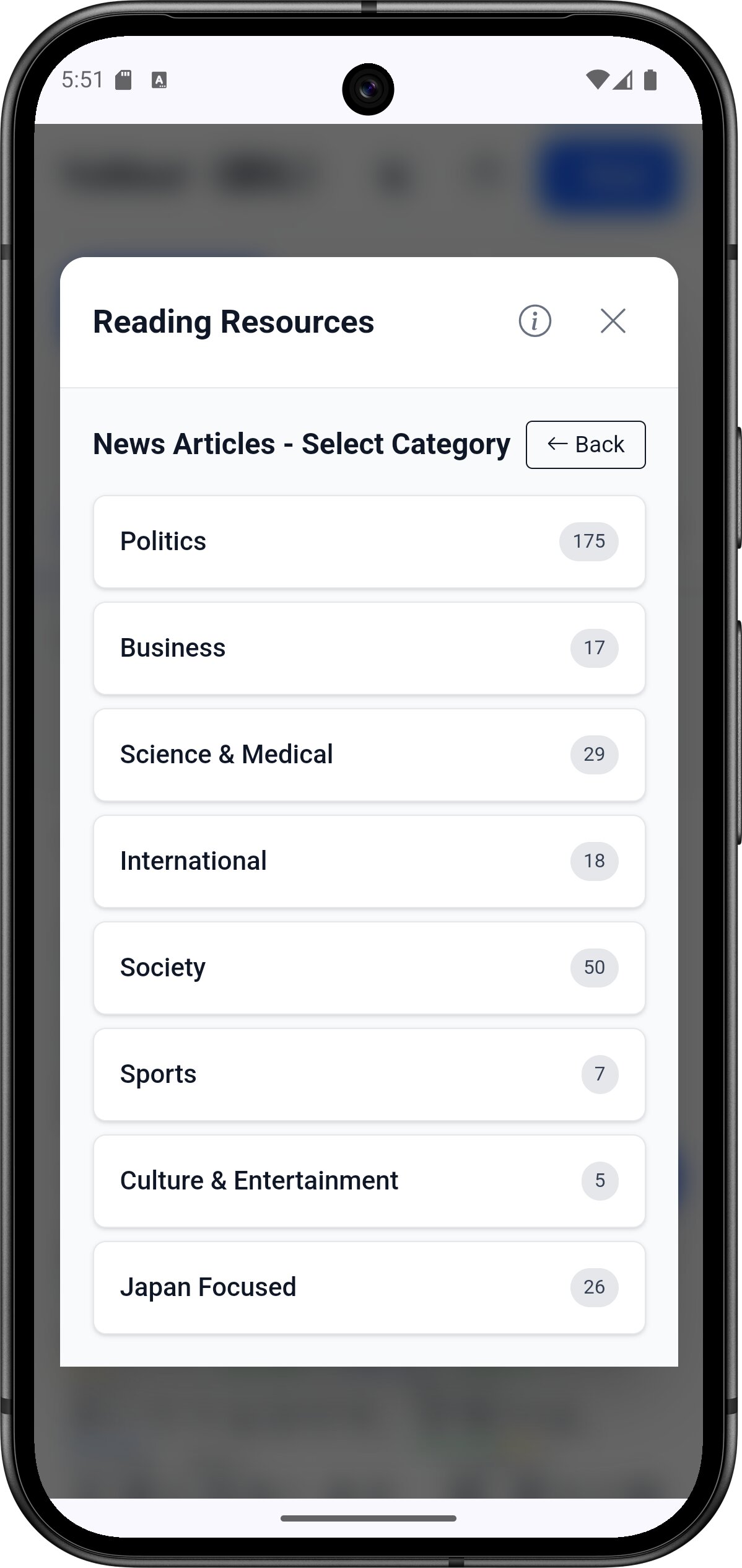 YoMoo news articles category selection screen showing Politics, Business, Science, International, Society, Sports, and Japan Focused categories with article counts for JLPT reading practice